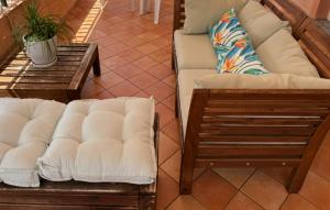 two couches and a coffee table in a room at A Casa di Laura in Praia a Mare