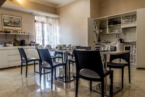 En restaurang eller annat matställe på San Pietro's Home - Guesthouse