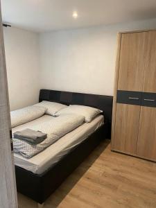 Postel nebo postele na pokoji v ubytování Apartmány Domaša Poľany