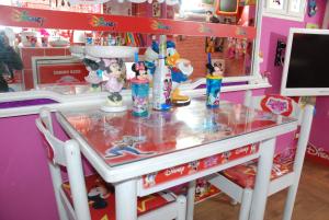 a kitchen counter with a glass counter top at DISNEY FAMILY Airport Catania City in CTA