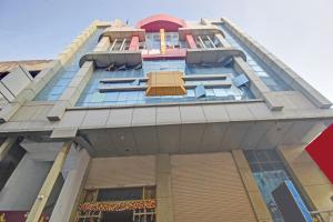 a tall building with many windows on it at Super Collection O Regal Near ISKON TEMPLE , ABIDS in Hyderabad