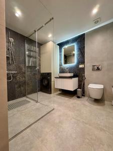 a bathroom with a shower and a toilet and a sink at Apartment on Charents Street in Sari Tʼag