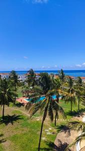 a view of a beach with palm trees and the ocean at Sultan Palace in Mombasa