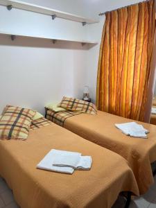 two beds sitting next to each other in a room at Agriturismo Buranco in Monterosso al Mare