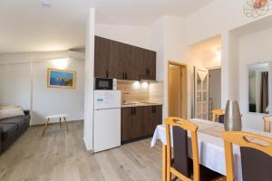 a small apartment with a kitchen and a living room at Villa K&F Borik in Zadar