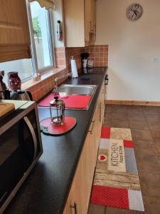 Kuchyň nebo kuchyňský kout v ubytování Hawthorns Holiday Home