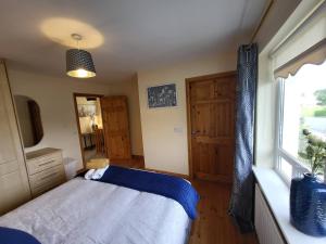 Postel nebo postele na pokoji v ubytování Hawthorns Holiday Home