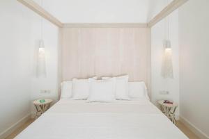 Postel nebo postele na pokoji v ubytování Hotel Es Marès