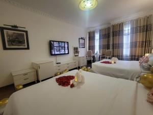 Voodi või voodid majutusasutuse Luxor Boutique Hotel toas