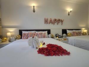 Voodi või voodid majutusasutuse Luxor Boutique Hotel toas