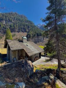 a small house in the middle of a mountain at Private 3-story villa in Val calanca, Rossa in Rossa