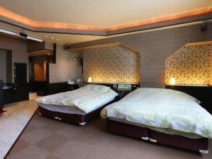 Letto o letti in una camera di G HOTEL 一宮 -Hotel & Resorts-