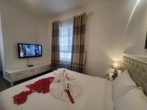 Voodi või voodid majutusasutuse Luxor Boutique Hotel toas