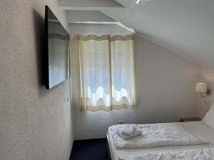 Postel nebo postele na pokoji v ubytování Gästehaus Elzblick 2