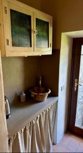 Kuchyň nebo kuchyňský kout v ubytování Lanternone nel Borgo - Appartamento con Vasca Idromassaggio + 5 fotografií