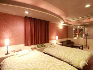 Letto o letti in una camera di G HOTEL 一宮 -Hotel & Resorts-