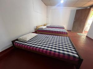 Letto o letti in una camera di Gleeful Hostel