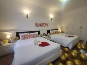 Voodi või voodid majutusasutuse Luxor Boutique Hotel toas