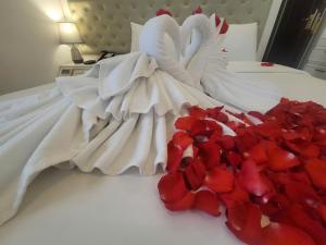 Voodi või voodid majutusasutuse Luxor Boutique Hotel toas
