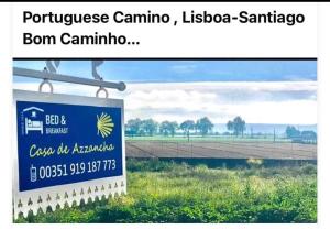 a sign for a farm with a field in the background at Casa de Azzancha in Azinhaga
