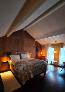 a bedroom with a large bed in a room at ONGA Boutique Lodge in Alta