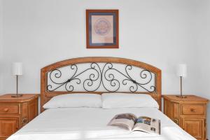 A bed or beds in a room at Aparthotel Ona Cala Pi Club