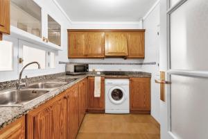 A kitchen or kitchenette at Aparthotel Ona Cala Pi Club