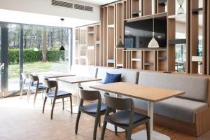 TV a/nebo společenská místnost v ubytování Holiday Inn Express Neunkirchen by IHG