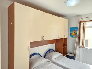 Postel nebo postele na pokoji v ubytování Cortile Maggiore Home