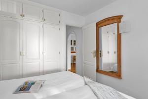 A bed or beds in a room at Aparthotel Ona Cala Pi Club
