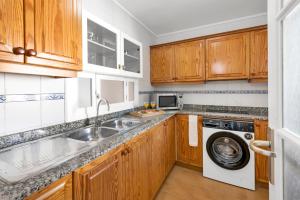 A kitchen or kitchenette at Aparthotel Ona Cala Pi Club