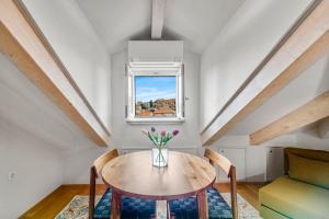 a dining room with a table and a window at Palmotta Palace in Dubrovnik