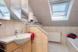 Ένα μπάνιο στο Ferienwohnung Plocher