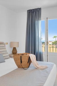 A bed or beds in a room at Aparthotel Ona Cala Pi Club