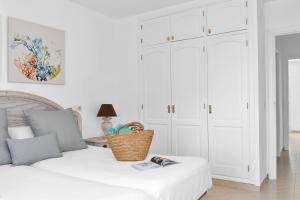 A bed or beds in a room at Aparthotel Ona Cala Pi Club