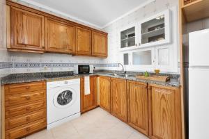 A kitchen or kitchenette at Aparthotel Ona Cala Pi Club