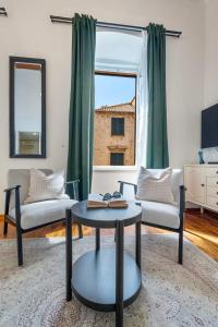 a living room with a couch and a table at Palmotta Palace in Dubrovnik
