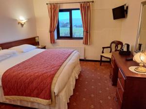 Postel nebo postele na pokoji v ubytování Corthna Lodge