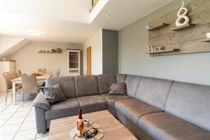 a living room with a couch and a table at Ferienhaus Lemmerquartier in Rüthen