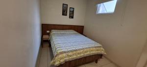 a small bed in a room with a window at Hotel Plaza Olido in Sao Paulo +36 photos