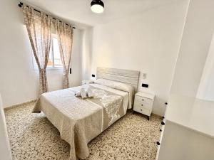 Katil atau katil-katil dalam bilik di Sousa by Staycare