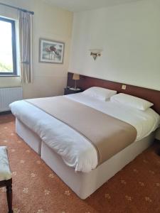 Postel nebo postele na pokoji v ubytování Corthna Lodge