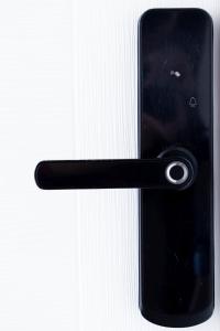 a black door handle of a cell phone at Apartment By the River in Niš +37 photos