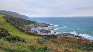 a view of the ocean from a hill at Lerryn Lodge - 2 bedroom in Looe +2 photos