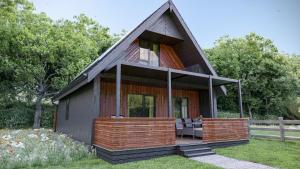 a small house with a gambrel roof at Cardinham Lodge 3 bedroom - max 6 occ - VP4 in Looe