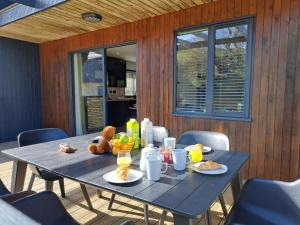 a blue table with food and drinks on it at Cardinham Lodge 3 bedroom - max 6 occ - VP4 in Looe