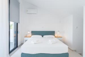 Postel nebo postele na pokoji v ubytování Kleoniki & Irida Residential Complexes