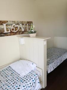 Posteľ alebo postele v izbe v ubytovaní Maisonnette T2 Bord de mer Guidel Plage