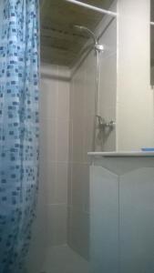 a bathroom with a shower with a shower curtain at African Tent in Ponte da Barca