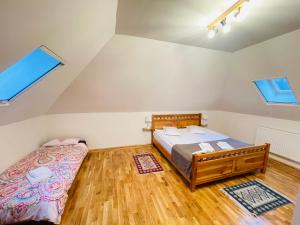 a bedroom with a bed and a window in it at Domeniul Bondarelului in Ocolişu Mic +99 photos